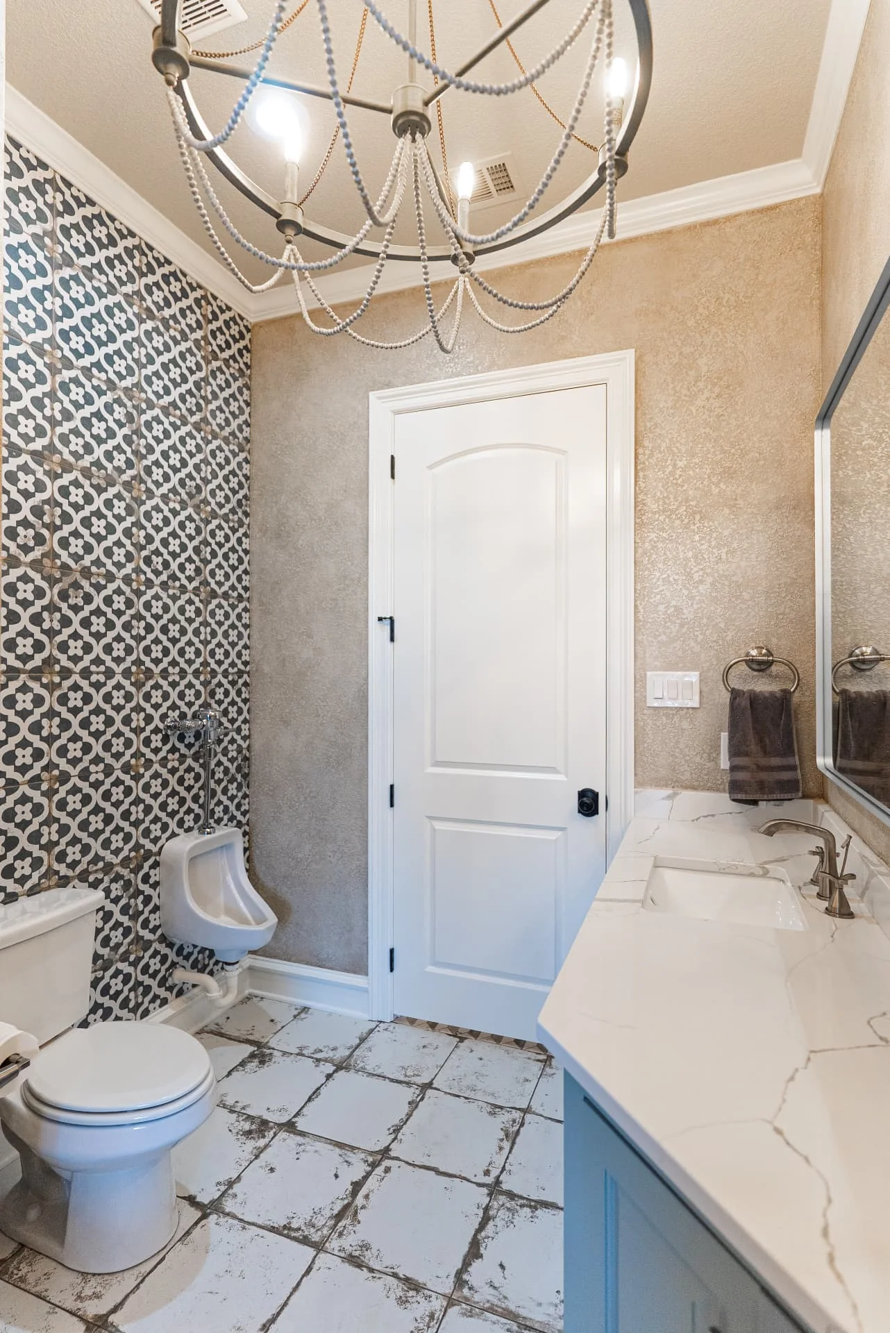 Powder room with patterned tile and vanity at The Flores Estate