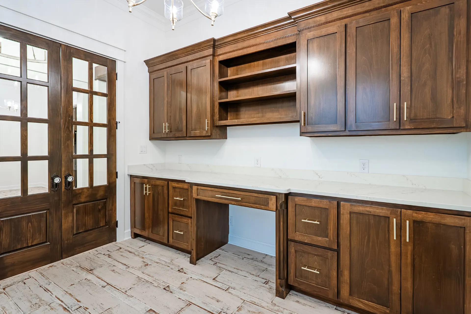 Built-in desk with espresso cabinetry in the study at 1607 NW 12th St
