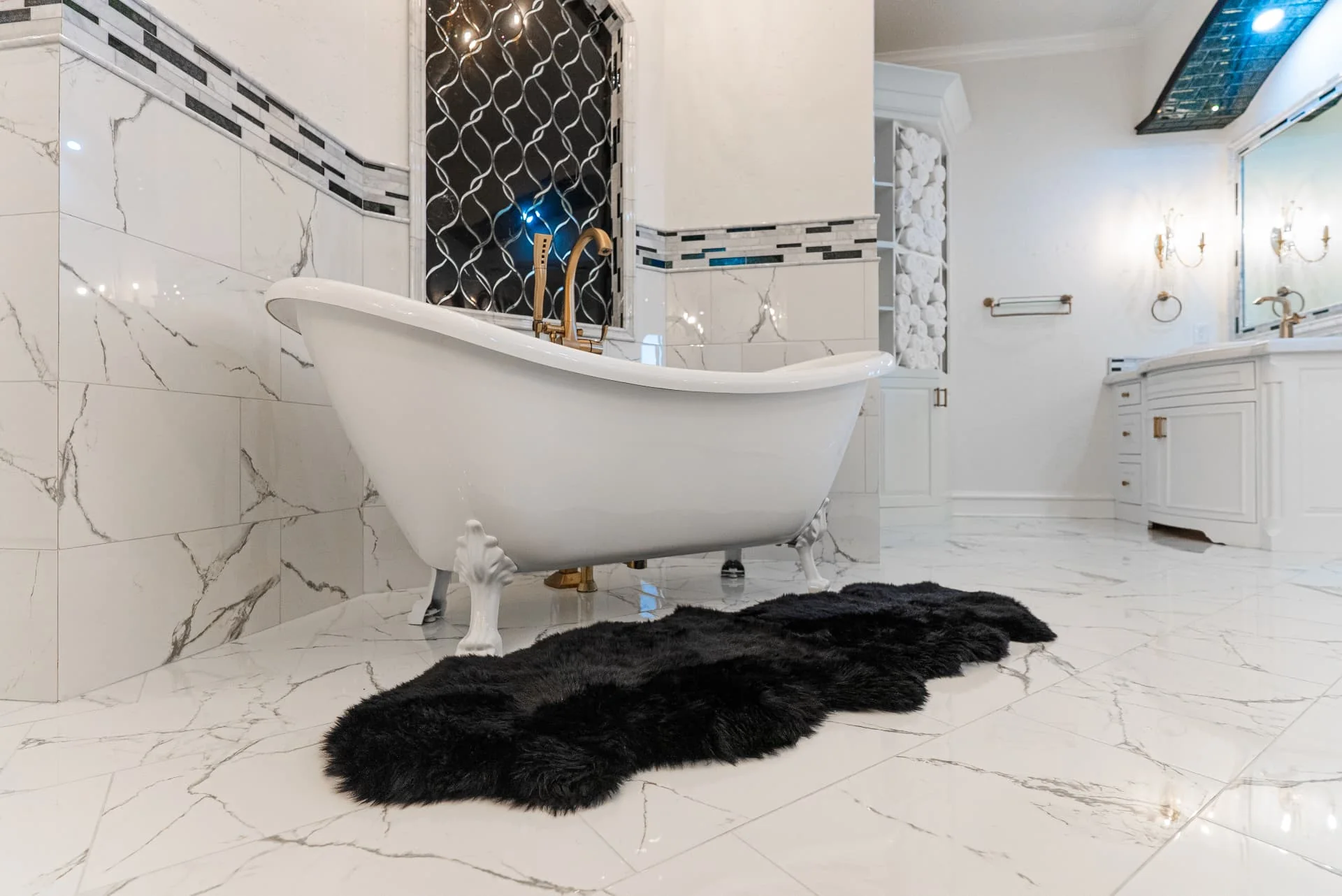 Freestanding bathtub and stone tile floor at The Flores Estate