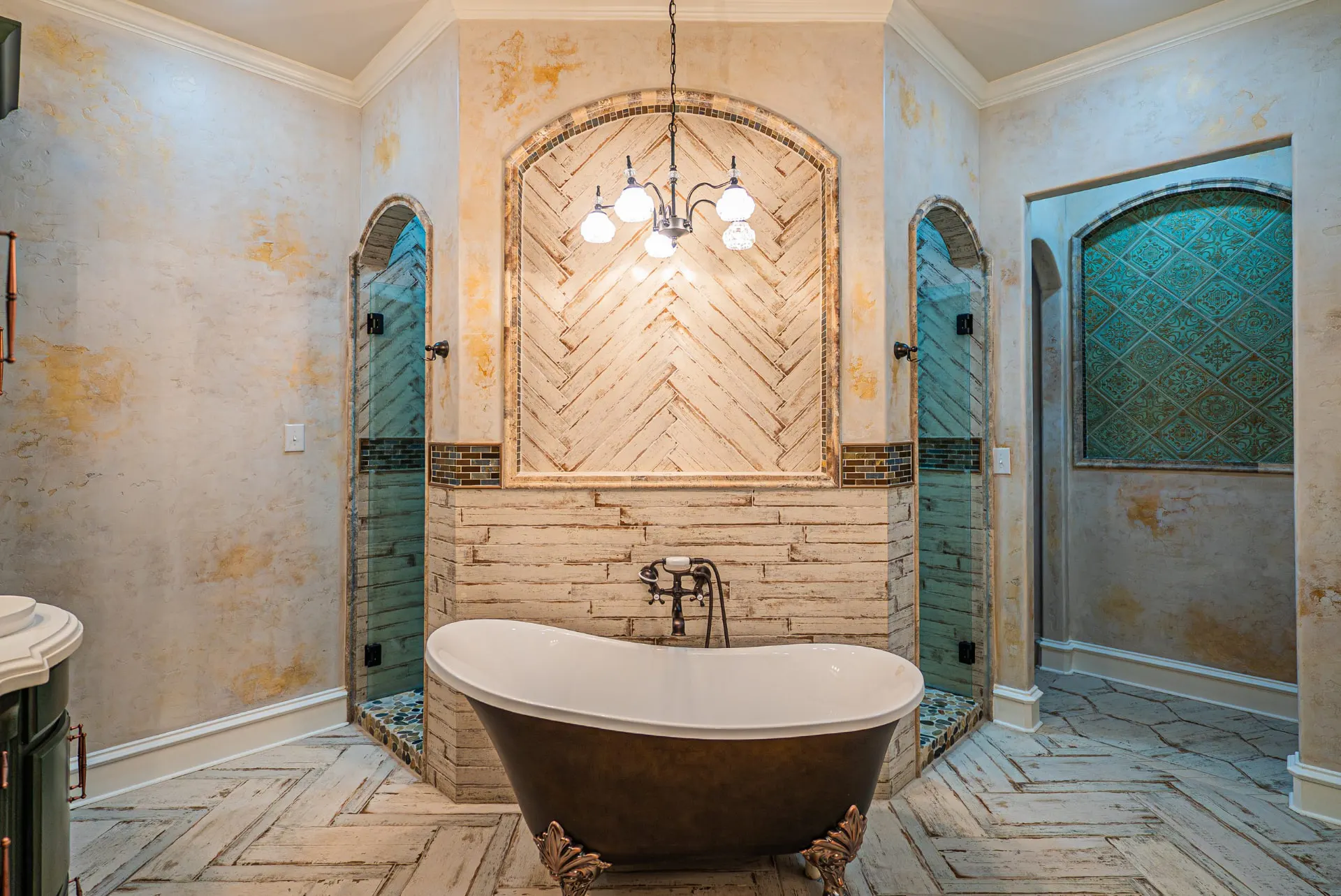 Freestanding tub at 5 Prairie Ln under a herringbone tile alcove