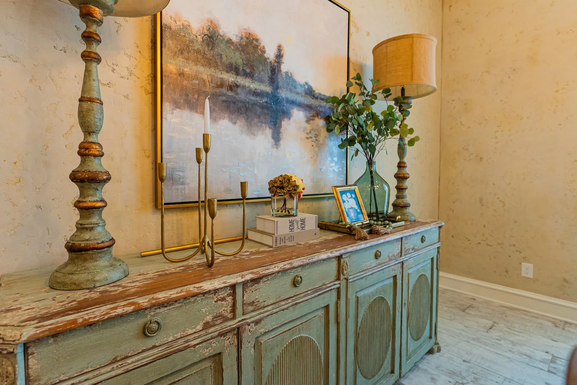 Console cabinet and framed artwork at The Flores Estate