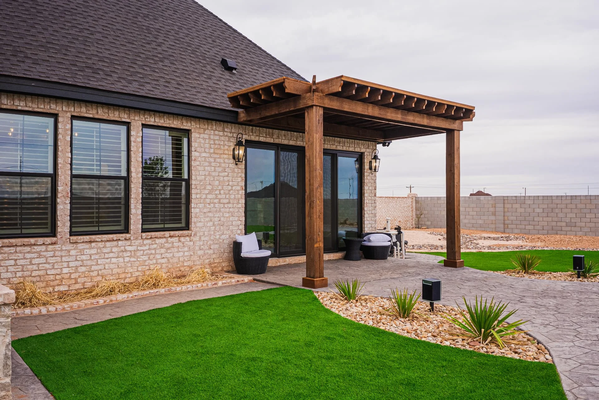 Rear patio and wood pergola at The Flores Estate