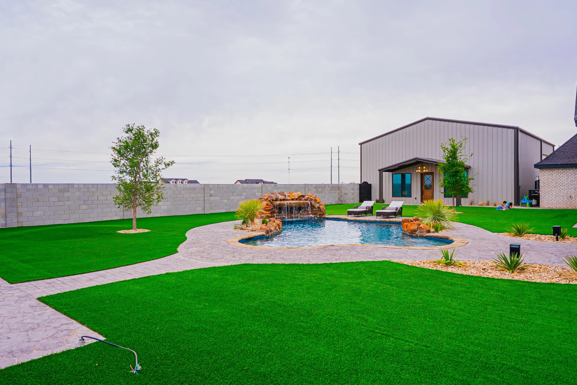 Pool and detached building at The Flores Estate
