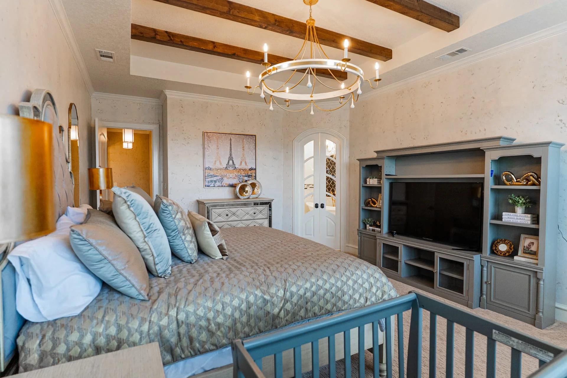 Bedroom seating, bed and media cabinet at The Flores Estate
