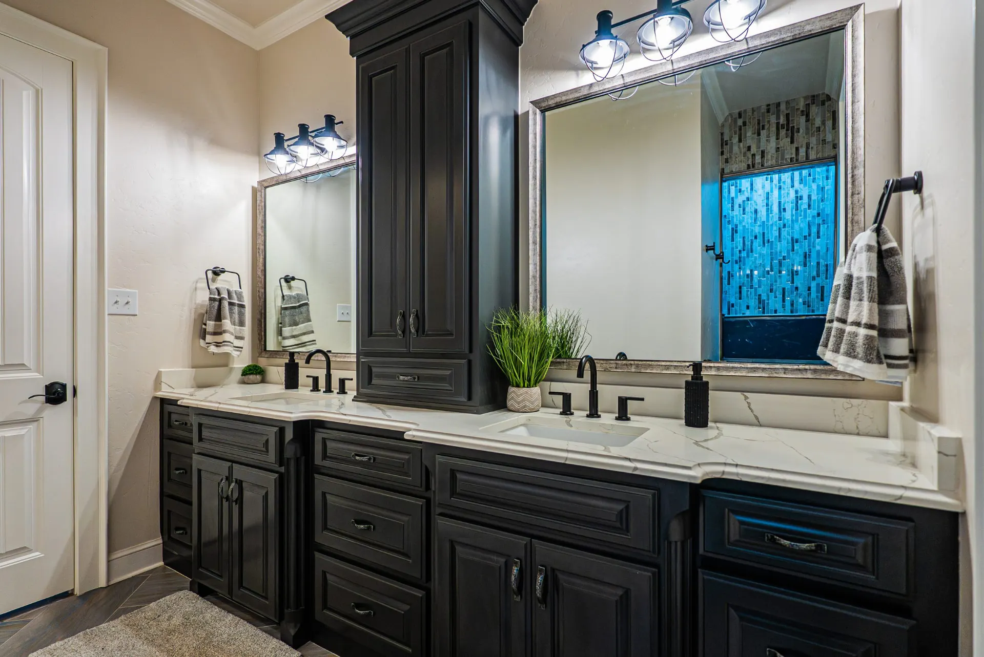 Double vanity at 5 Prairie Ln in black cabinetry with marble-look quartz