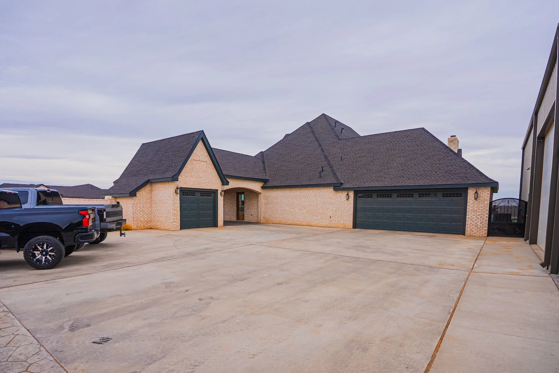 Garage courtyard and paved driveway at The Flores Estate