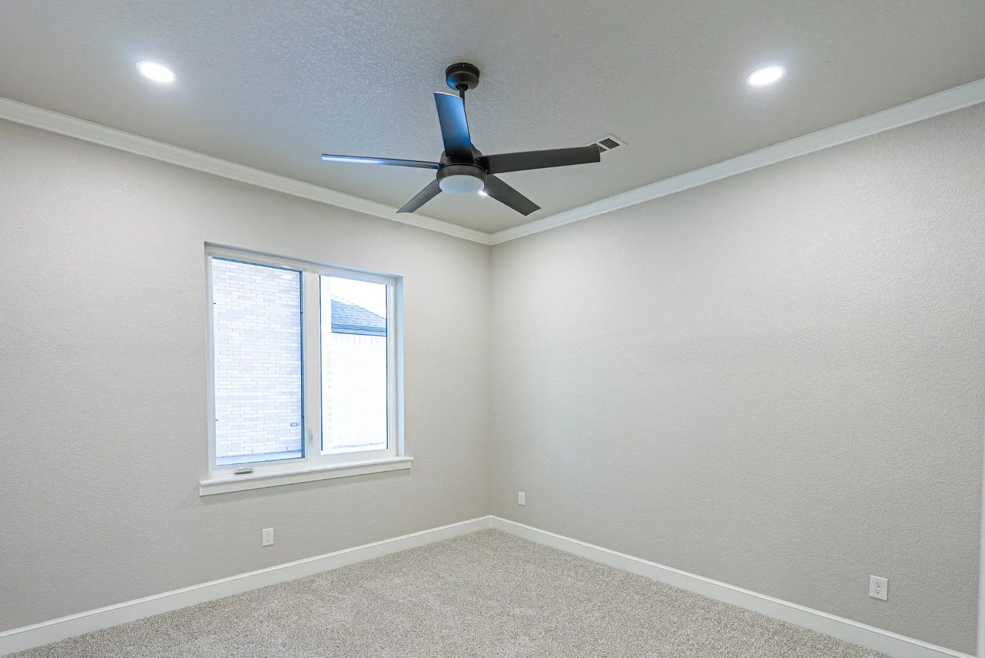 Bedroom at 27 Santiago Mission Dr with crown molding, recessed lighting and a modern dark ceiling fan