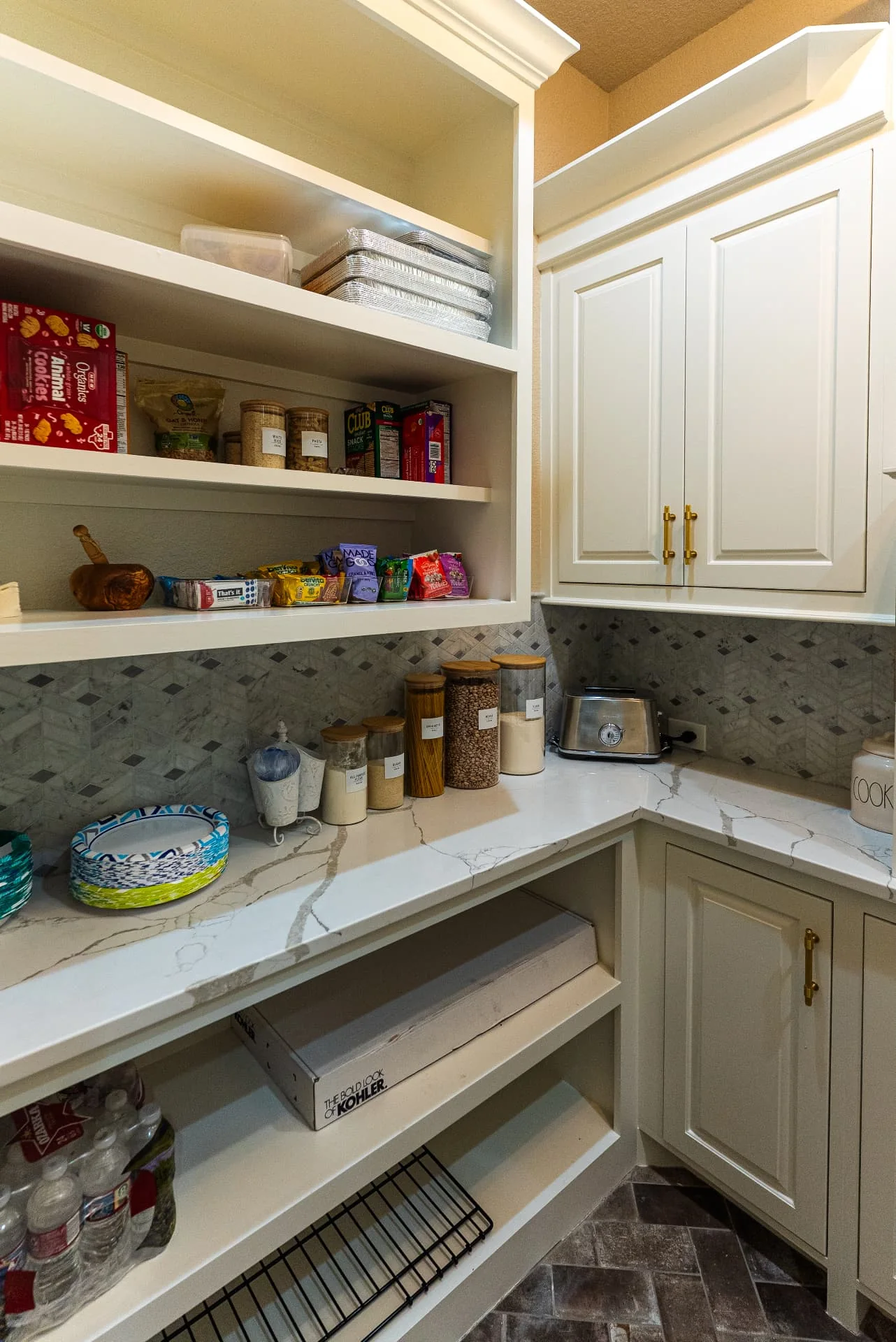 Walk-in pantry at The Flores Estate with shelving and countertop