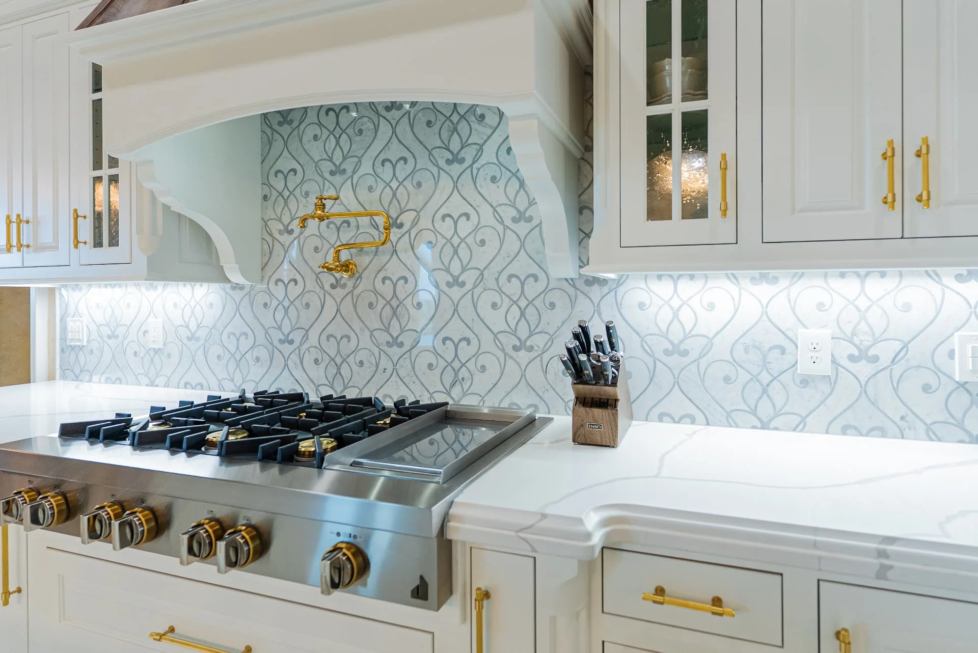 Range and patterned tile backsplash at The Flores Estate