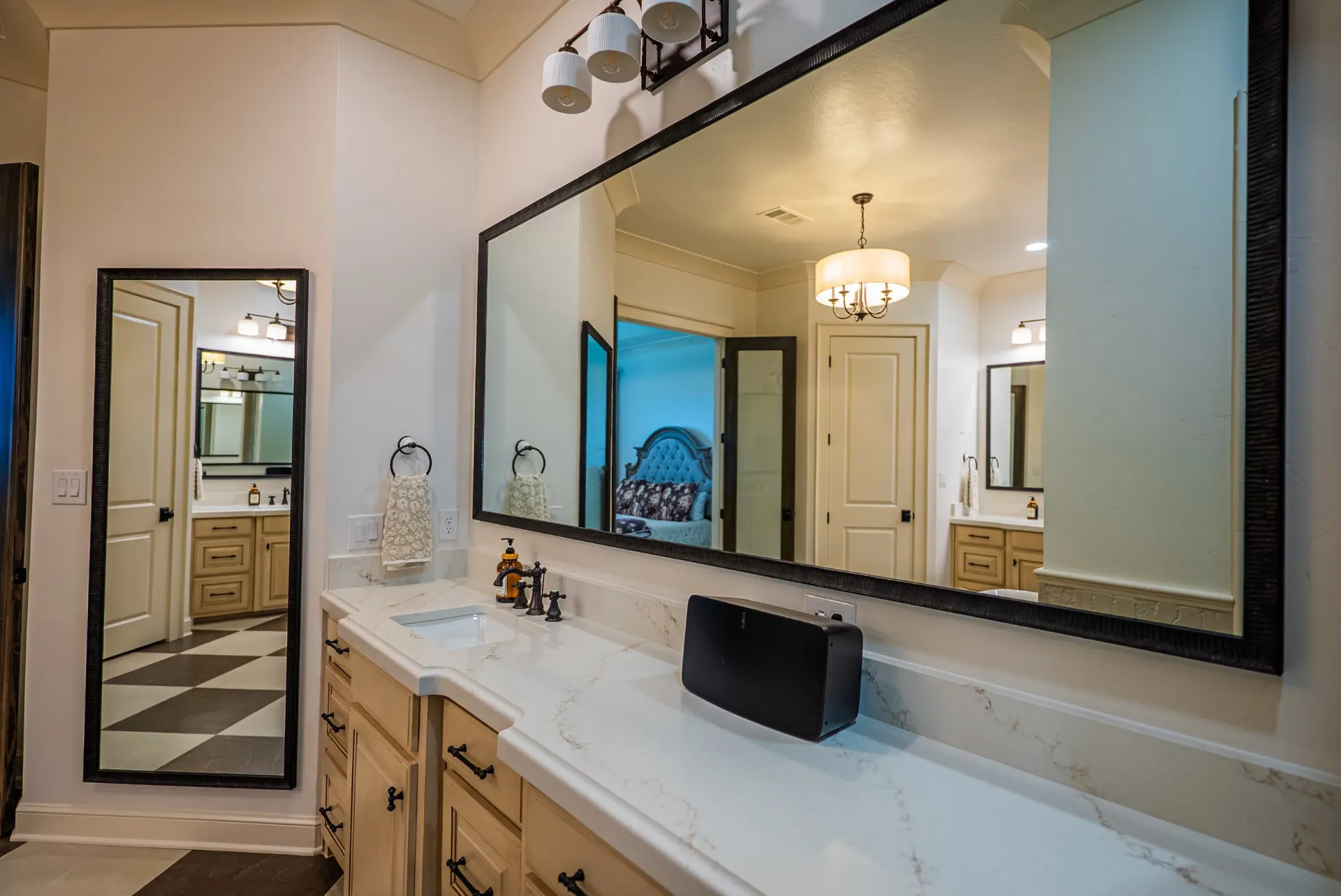 Second primary vanity at 1610 NW Eliam Dr with oil-rubbed bronze faucet and black-framed mirrors