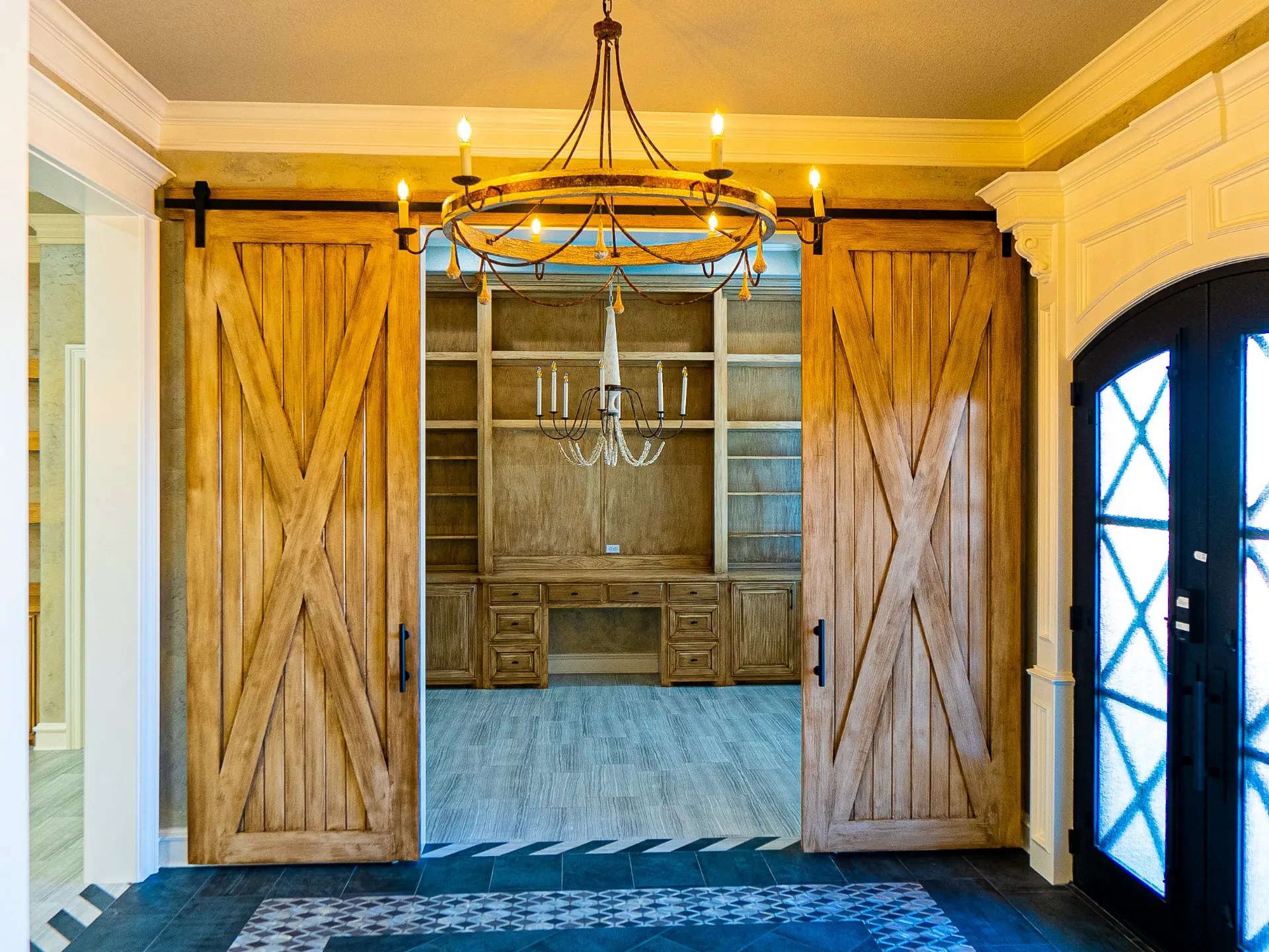 Distressed barn doors opening to a built-in home office at 1501 NW 12th St