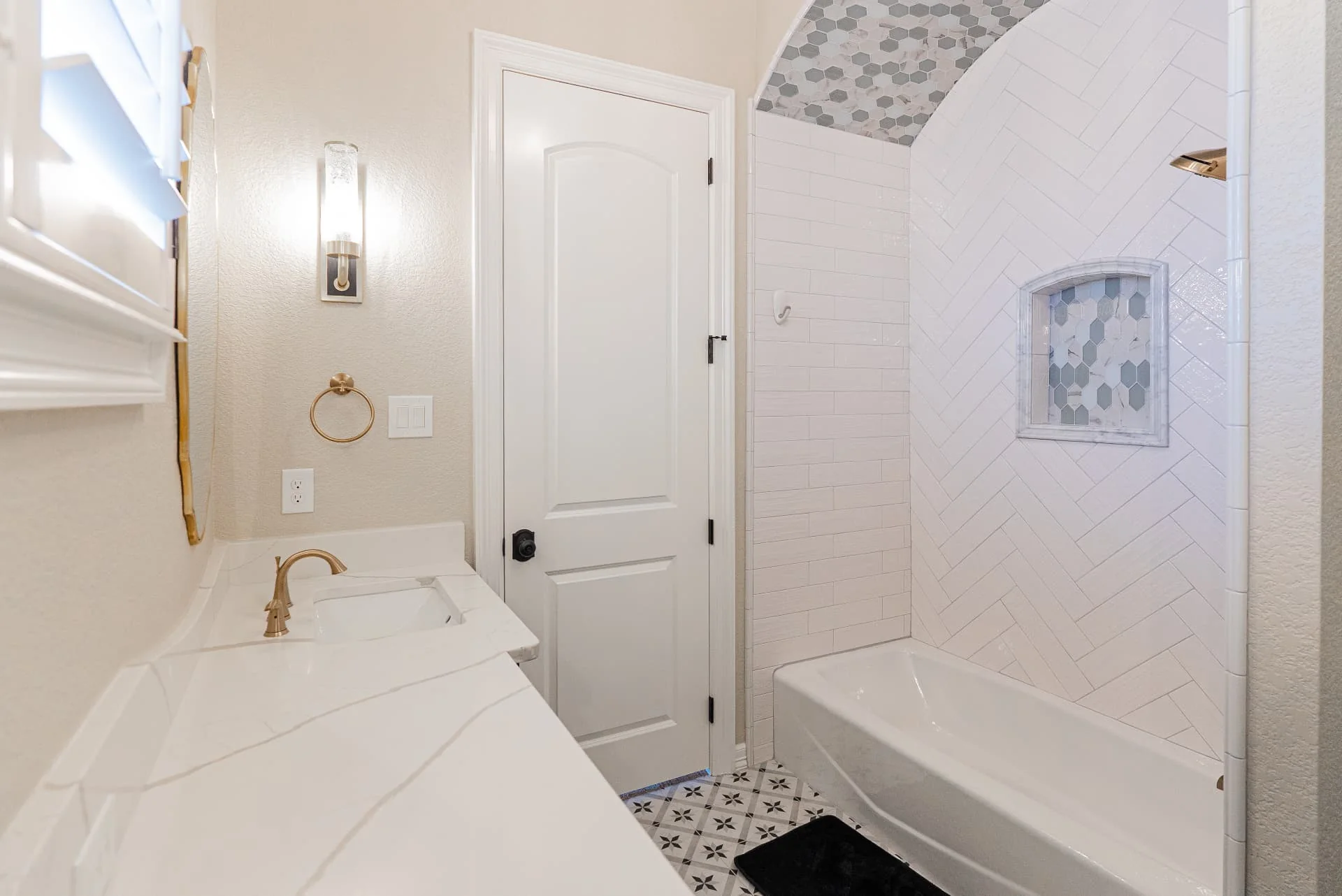 Bathroom vanity and tiled shower at The Flores Estate