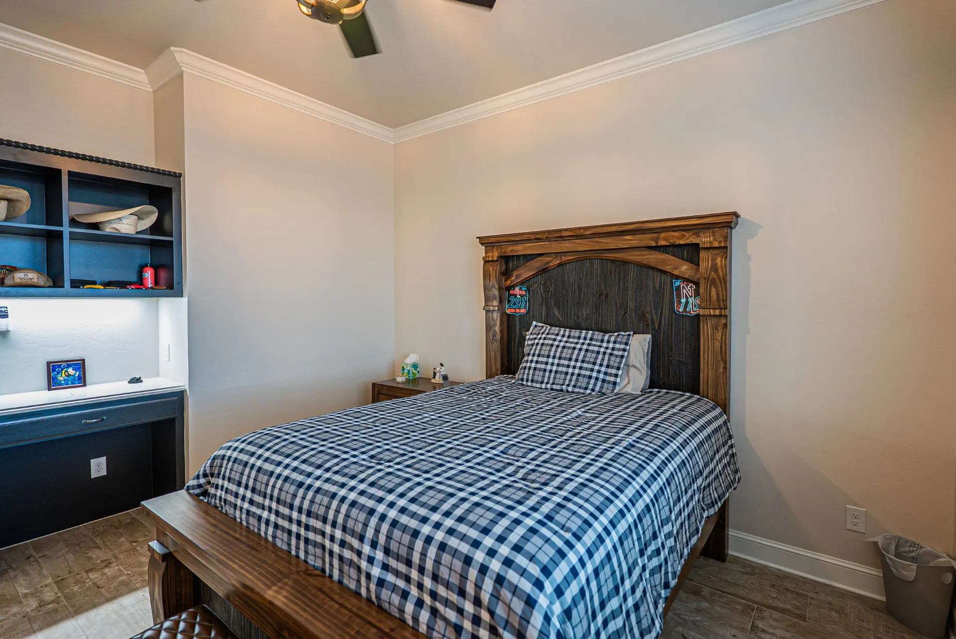Bedroom at 5 Prairie Ln with reclaimed wood headboard and built-in study desk